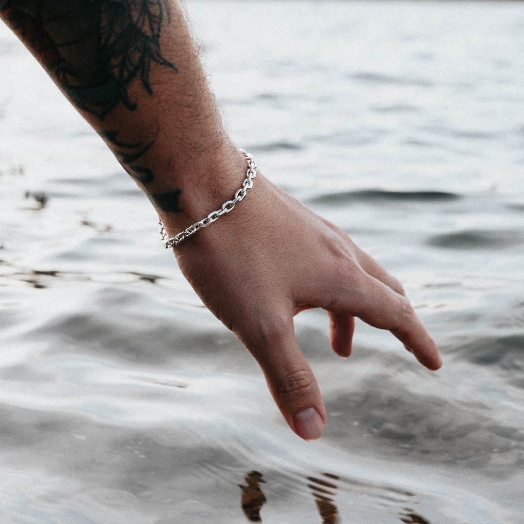 Cable Bracelet around wrist above water