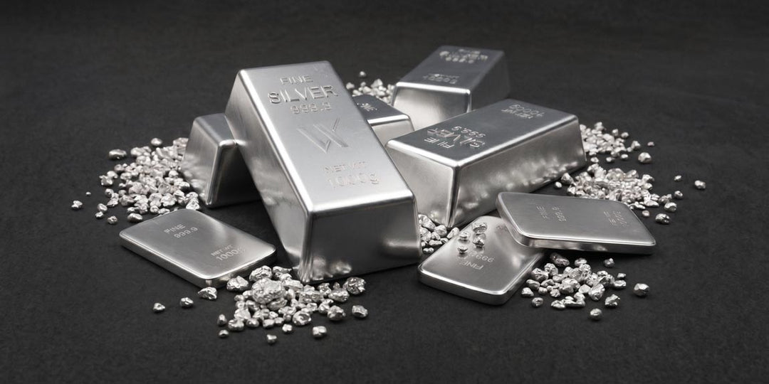 Fine silver bars and raw silver grain on dark background