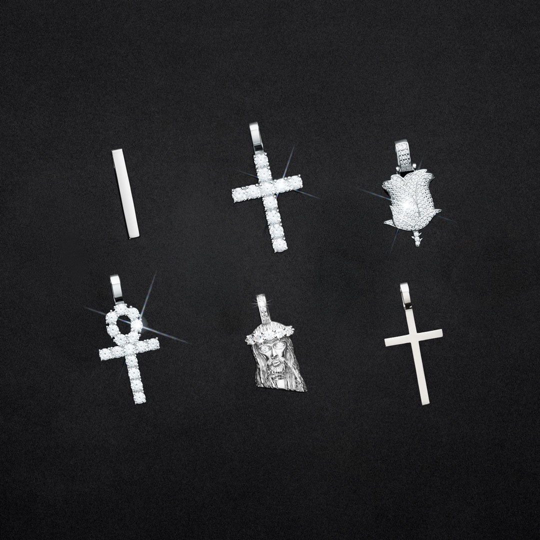 6 sterling silver pendants with diamonds on a black background