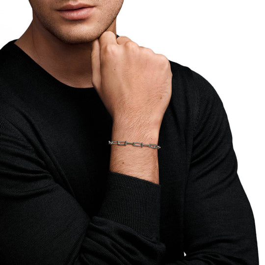 Mens model wearing roman link bracelet on wrist